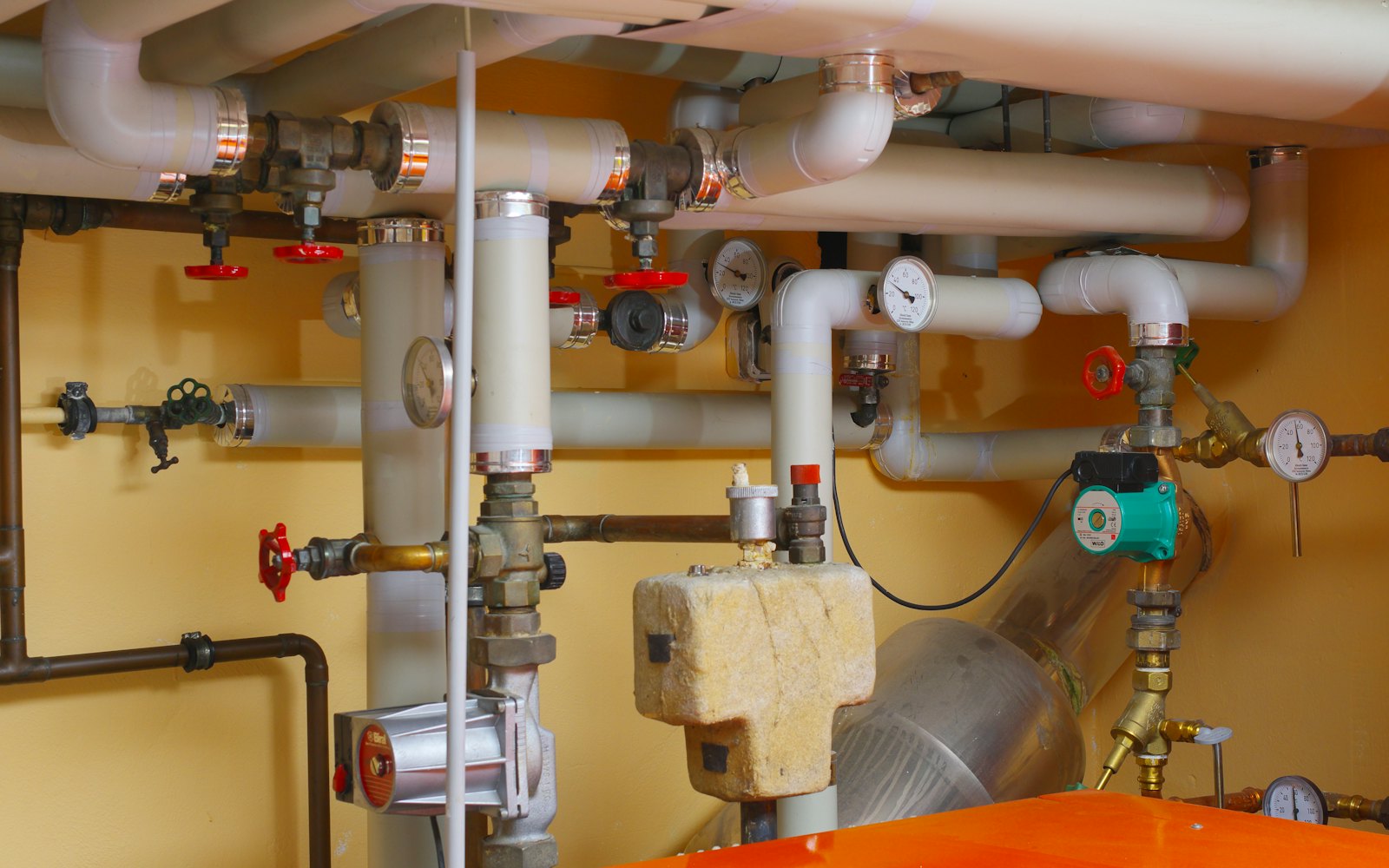 Copper pipes and valves in a plant room