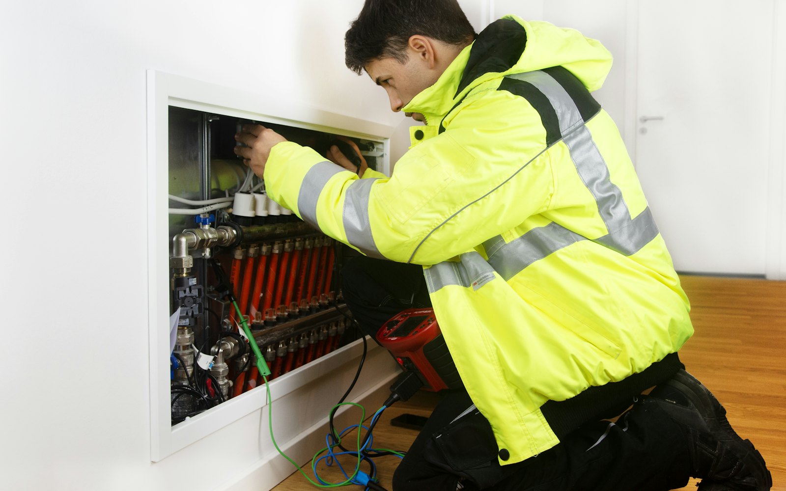 Heating engineer working on a boiler