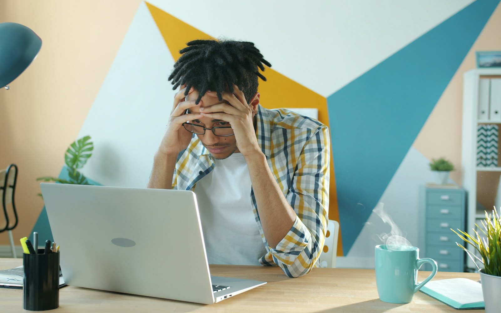 Business owner frustrated at a laptop