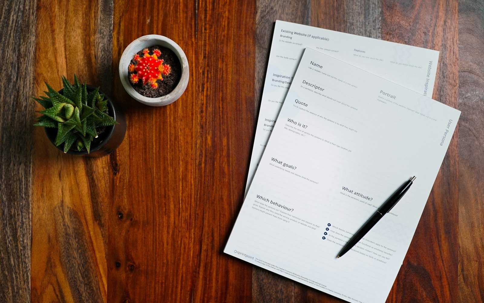 Invoice paperwork and a pen on a table