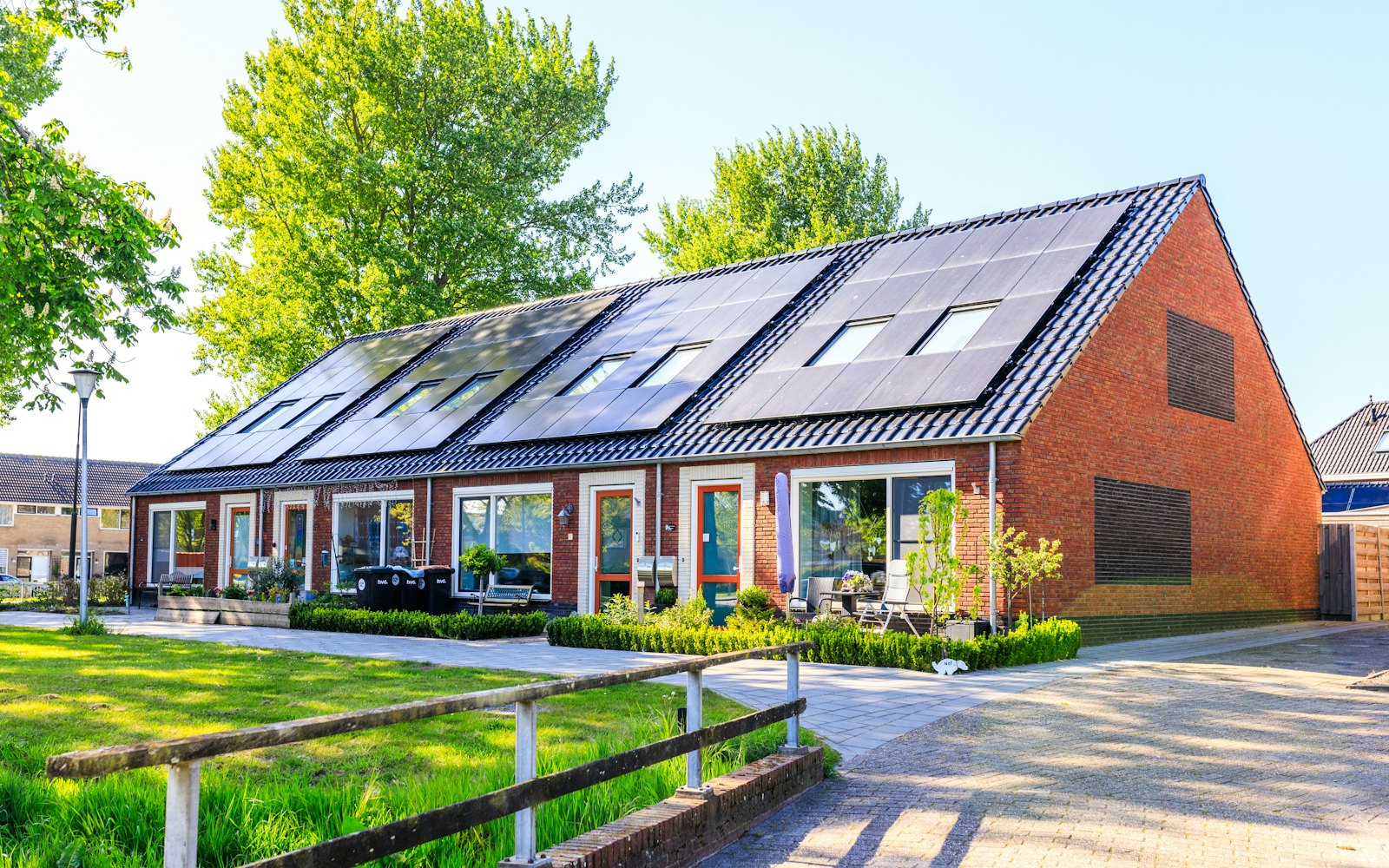 Row of new houses with rooftop solar panels