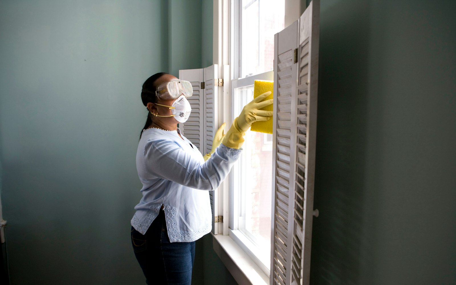 Cleaner wiping a window